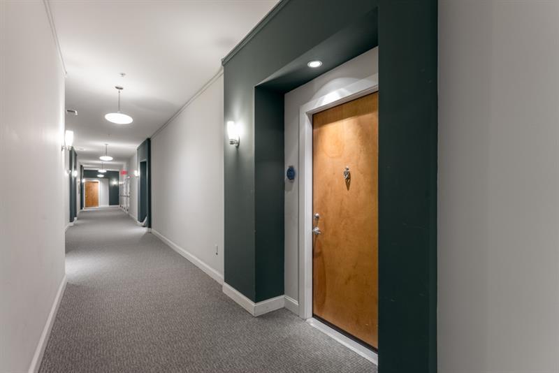 870 Inman Village Parkway Northeast, Unit 203 Atlanta, GA 30307 - Photo 2 of 43 a view of a hallway with wooden floor