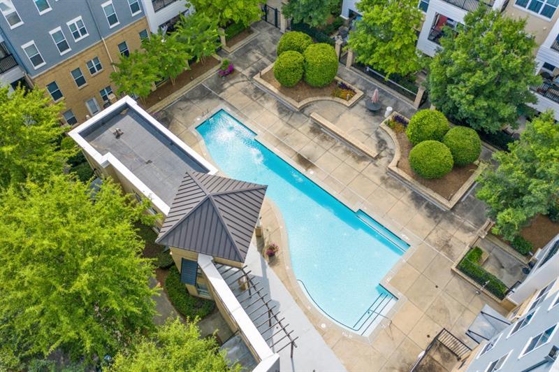 870 Inman Village Parkway Northeast, Unit 203 Atlanta, GA 30307 - Photo 32 of 43 an aerial view of a house with a yard and potted plants