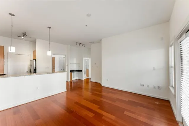 a view of a kitchen with a sink and a window