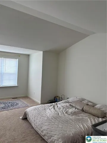 a bedroom with a bed