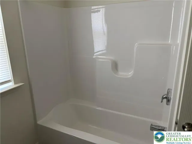 a close up of a bathtub curtain