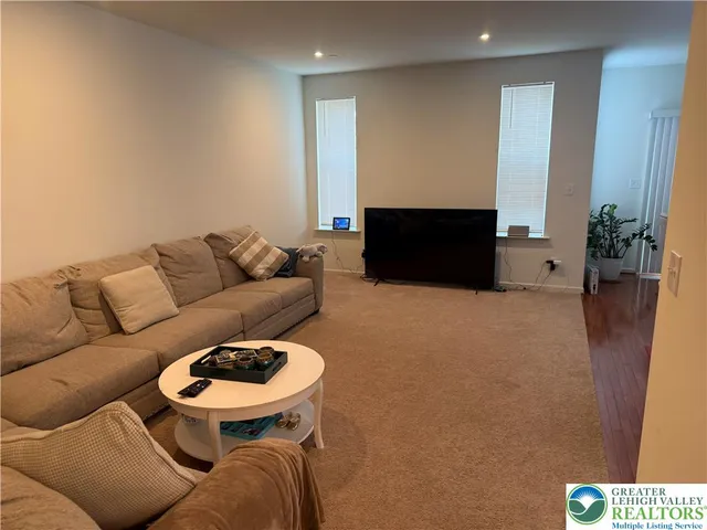 a living room with furniture and a couch