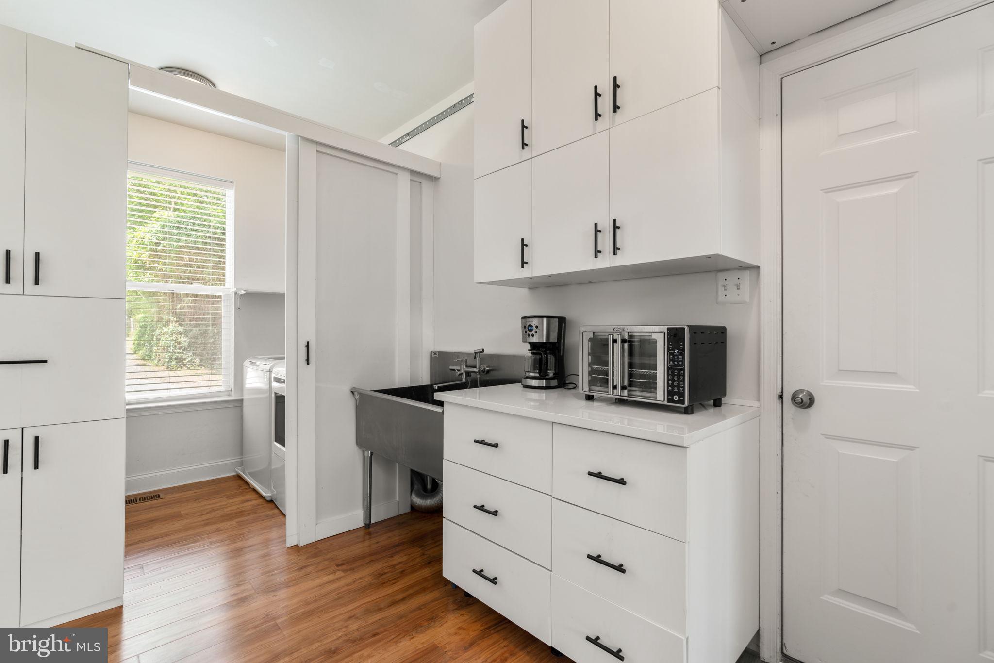 174 Acton Road Annapolis, MD 21403 - Photo 11 of 36 a kitchen with stainless steel appliances a stove and white cabinets