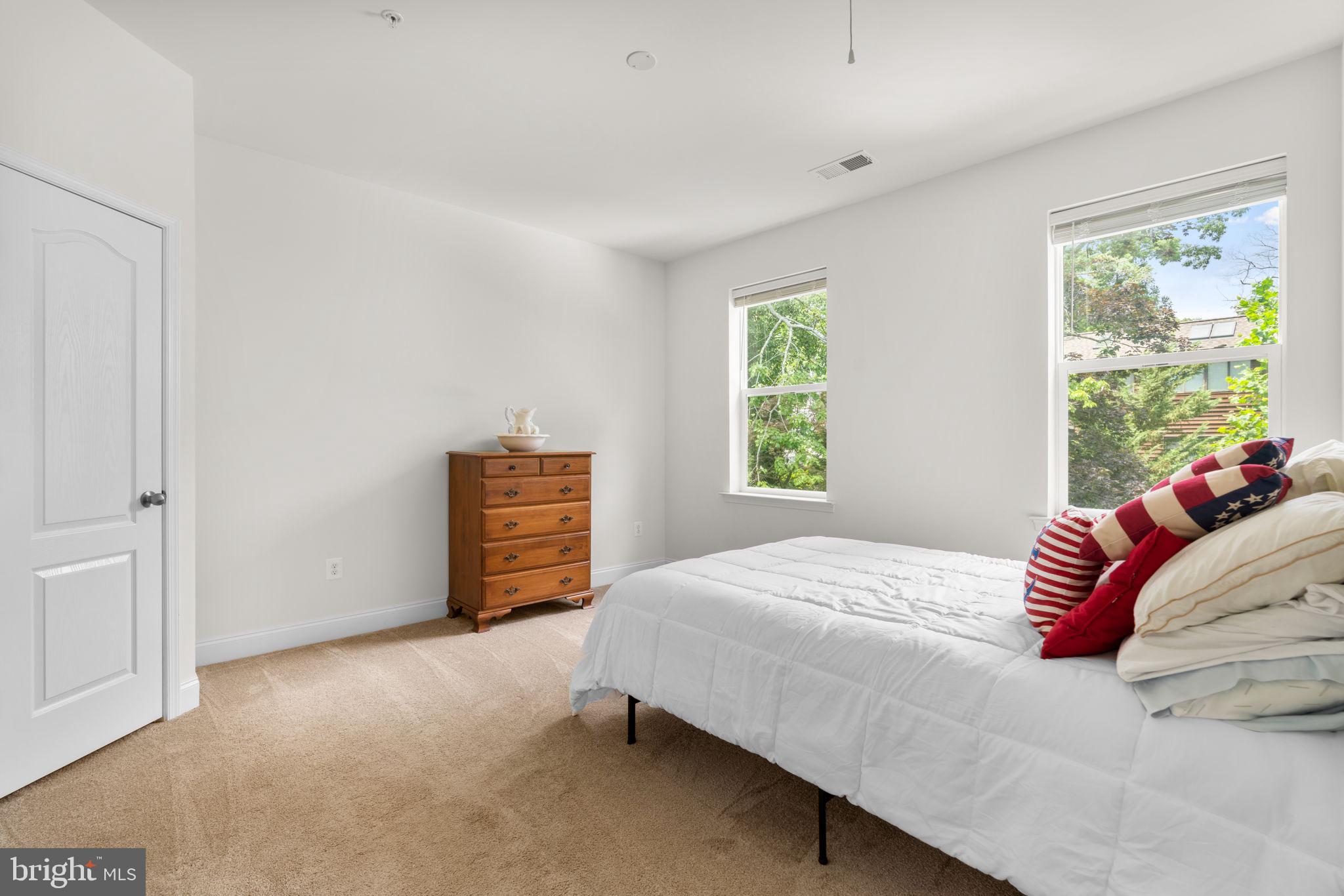 174 Acton Road Annapolis, MD 21403 - Photo 13 of 36 a bedroom with a bed and a window