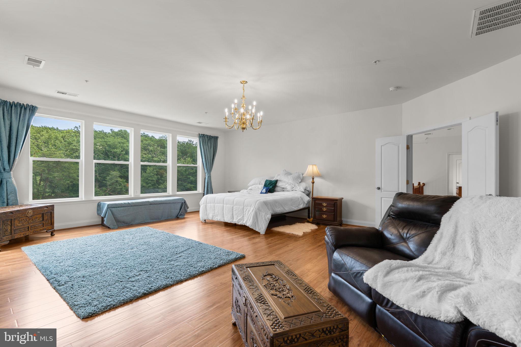 174 Acton Road Annapolis, MD 21403 - Photo 20 of 36 a bedroom with a bed and a couch