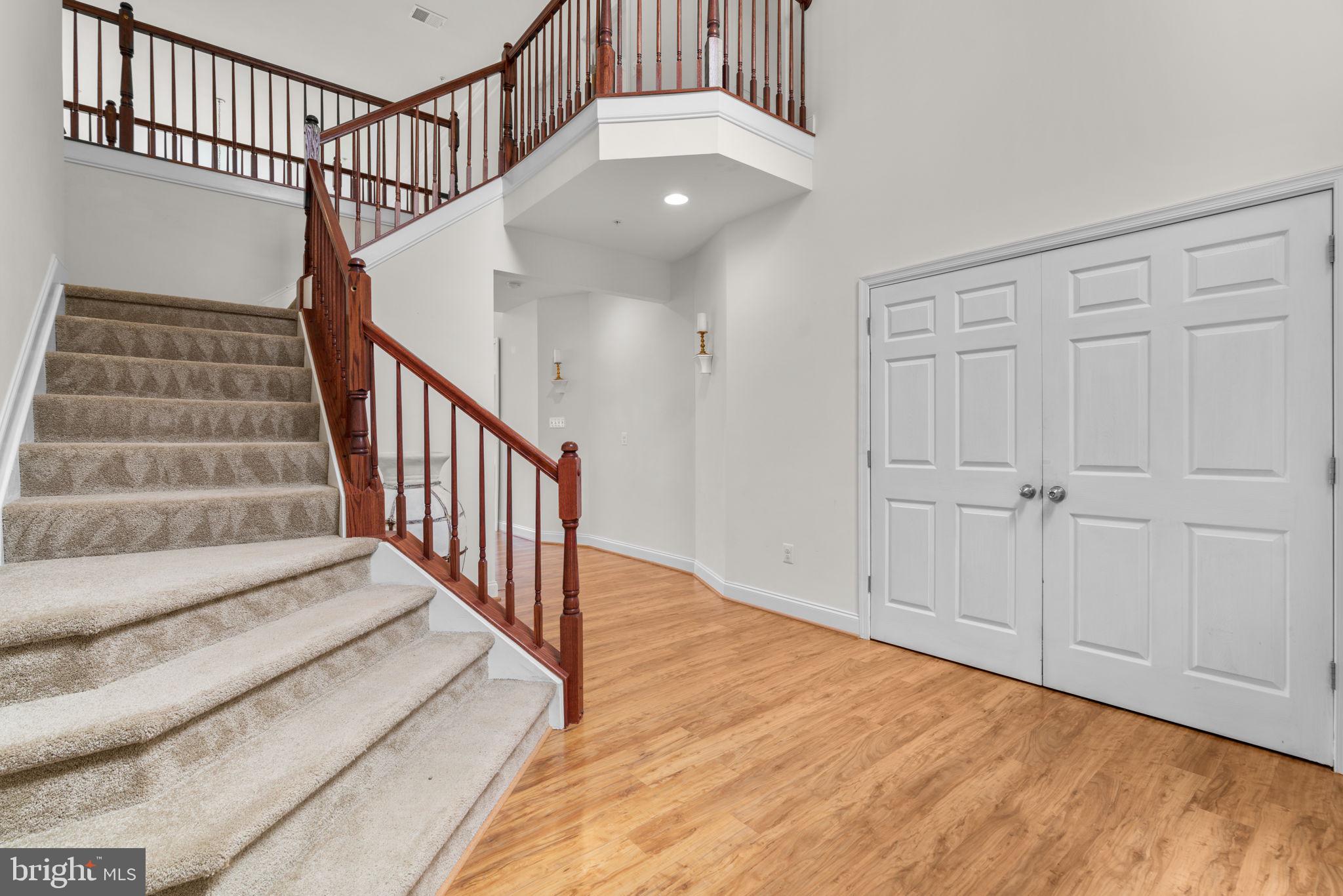 174 Acton Road Annapolis, MD 21403 - Photo 2 of 36 a view of staircase with white walls and a window