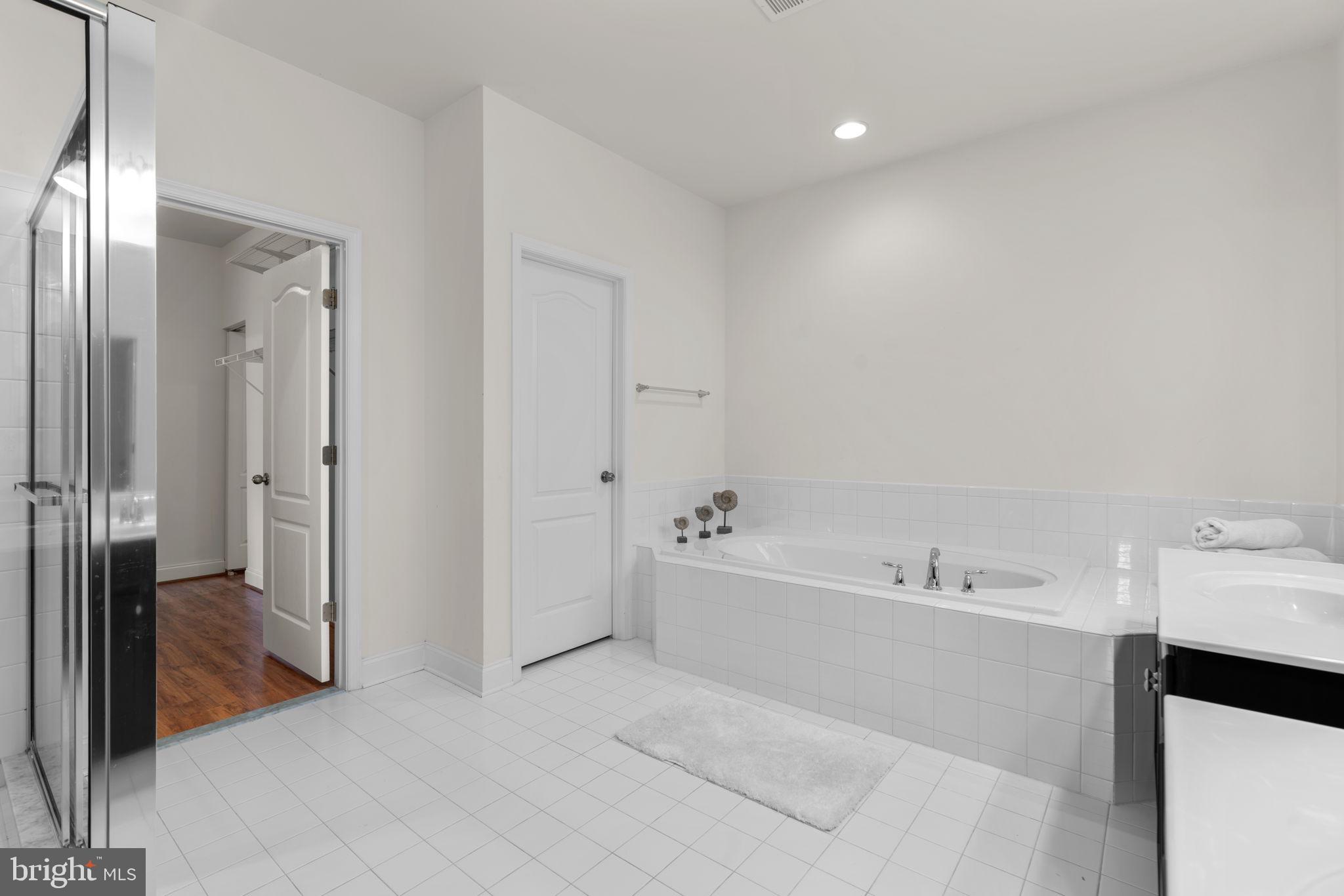 174 Acton Road Annapolis, MD 21403 - Photo 25 of 36 a spacious bathroom with a bathtub and a sink