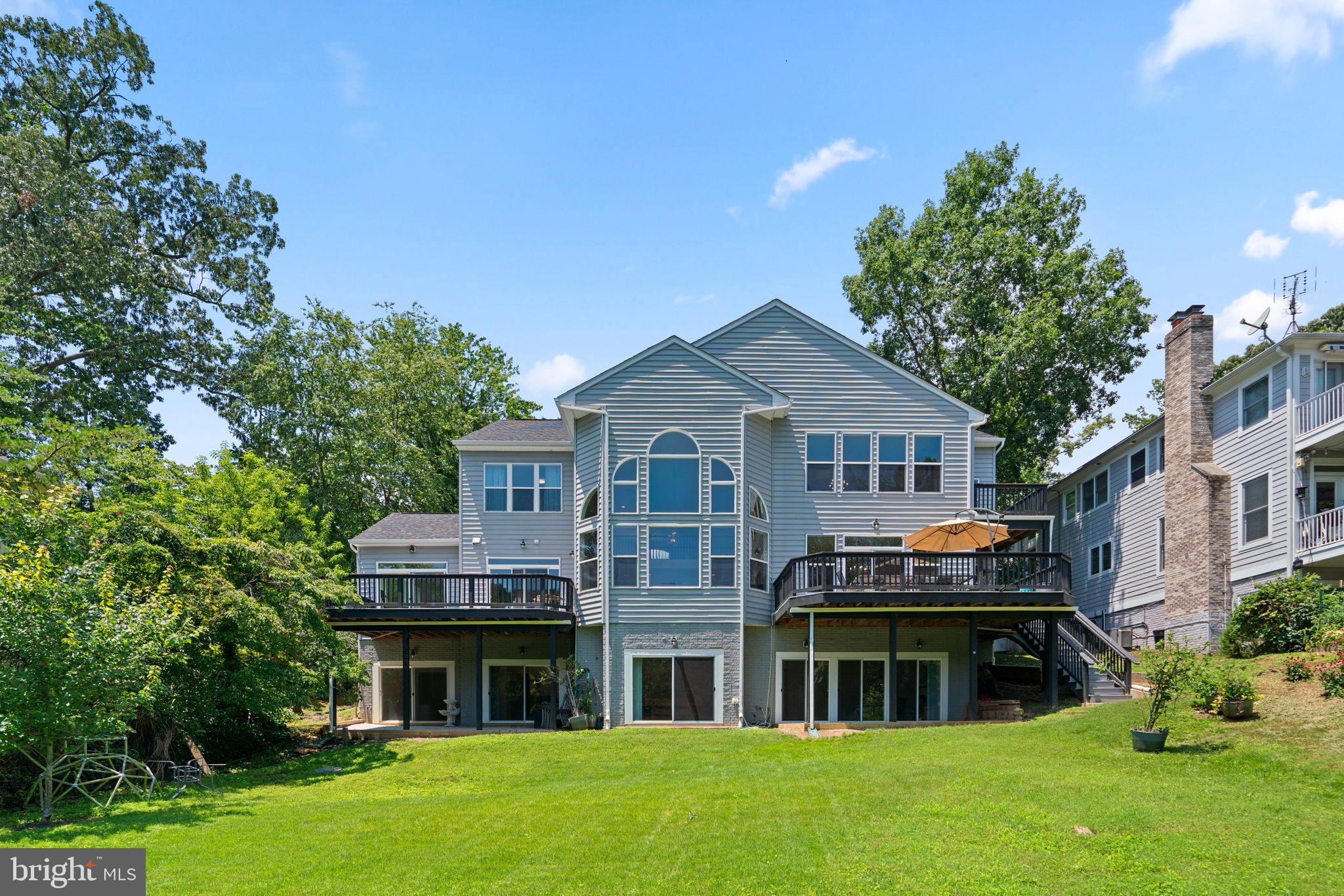 174 Acton Road Annapolis, MD 21403 - Photo 32 of 36 a front view of a house with a garden and plants