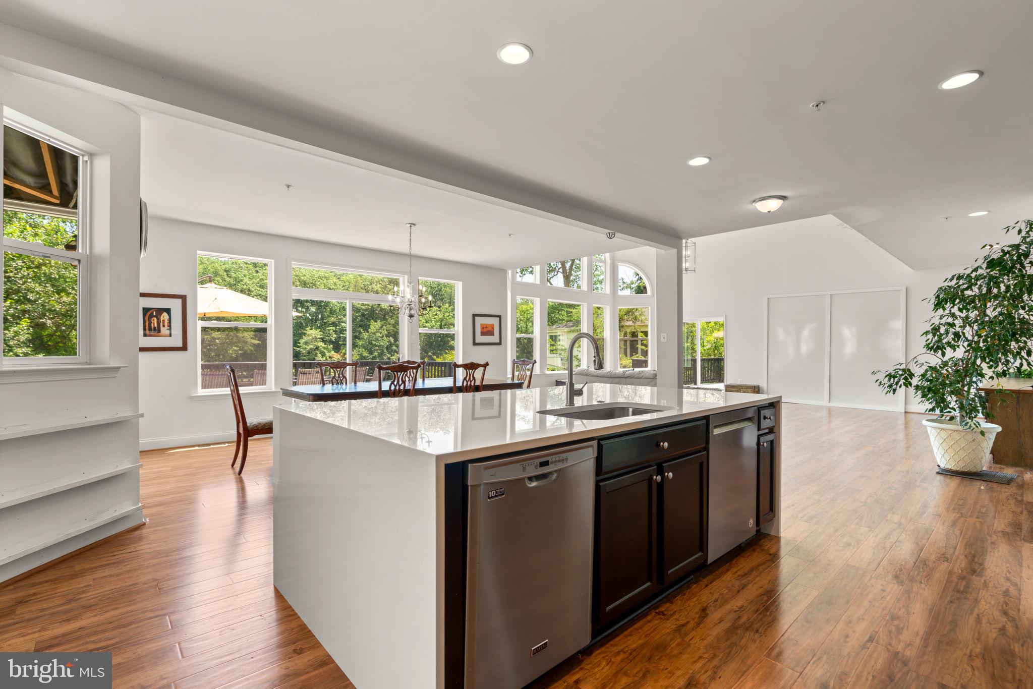 174 Acton Road Annapolis, MD 21403 - Photo 8 of 36 a kitchen with lots of counter top space and wooden floor