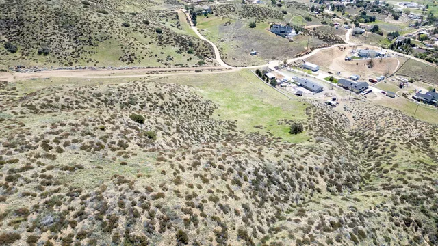 a view of a dry yard with mountain