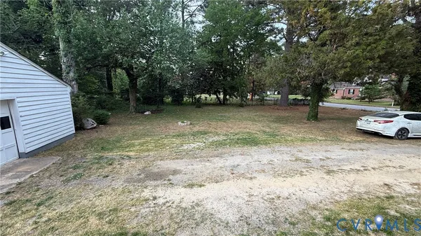 a view of a yard with a tree
