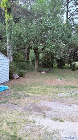 a backyard of a house with lots of green space