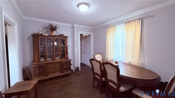 a living room with furniture a piano and a flat screen tv