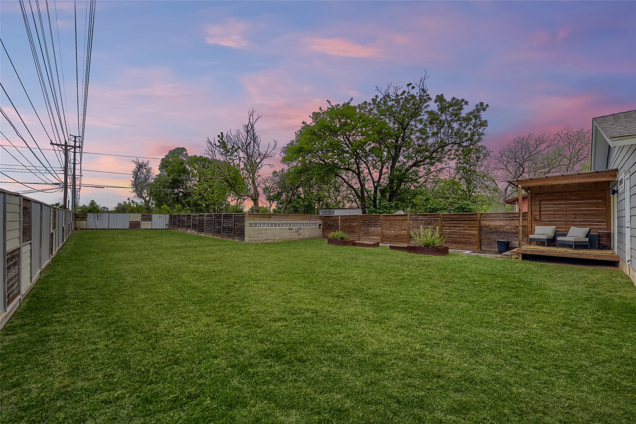 5707 Tracy Lynn Lane, Unit A Austin, TX 78721 - Photo 25 of 33 Fenced backyard featuring a wooden deck