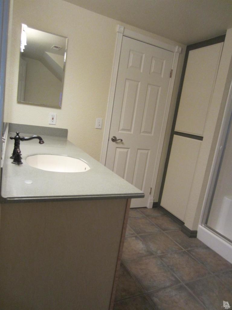 423 Reed Way Port Hueneme, CA 93041 - Photo 22 of 25 a bathroom with a sink and a mirror