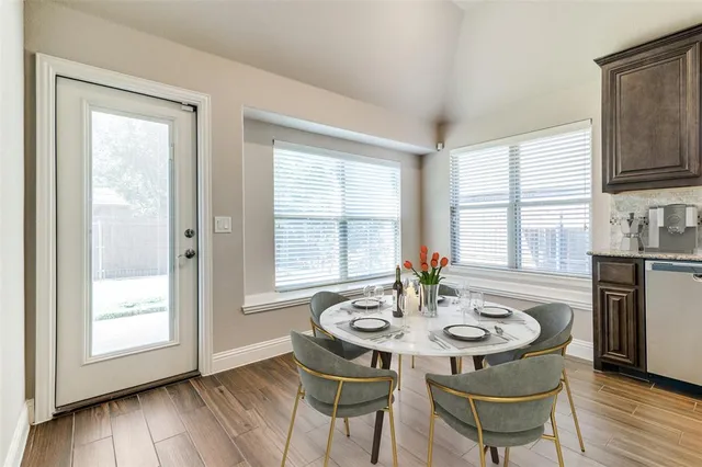 a view of a dining room with furniture window and wooden floor