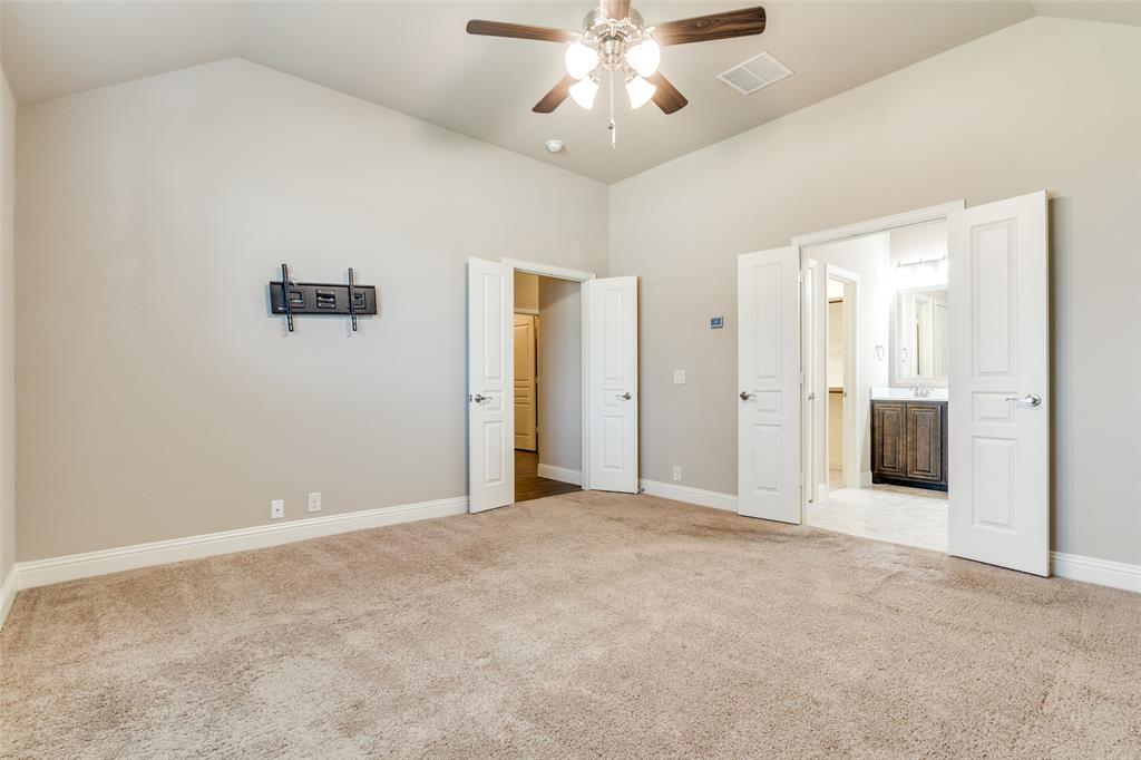 556 Avery Pointe Lavon, TX 75166 - Photo 15 of 32 an empty room with fan and entrance