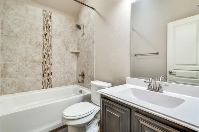 a bathroom with a sink a toilet and a bathtub