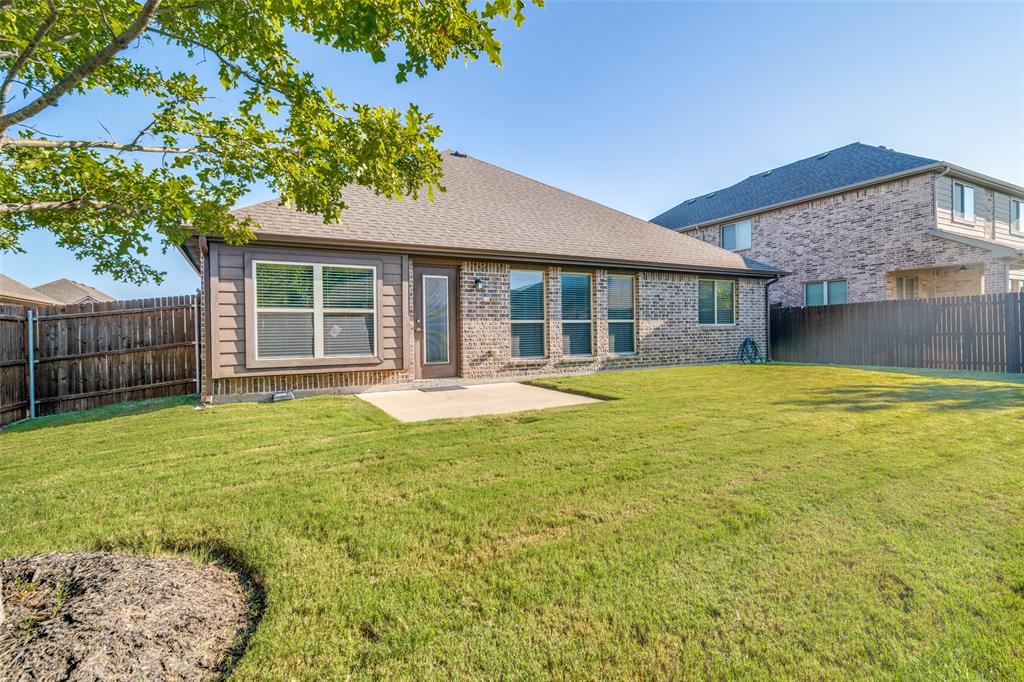 556 Avery Pointe Lavon, TX 75166 - Photo 28 of 32 a swimming pool with outdoor seating and yard