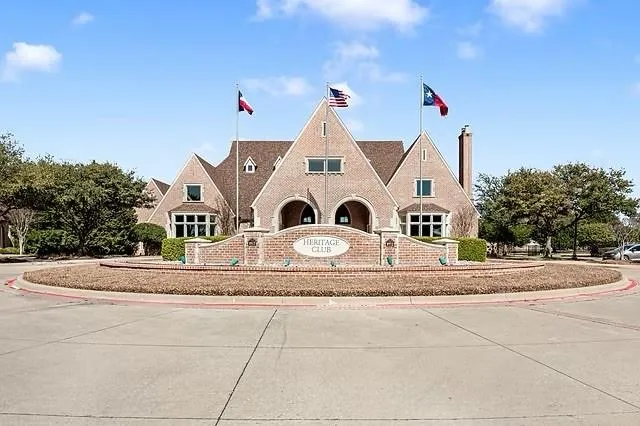 a view of a house with a yard and garage