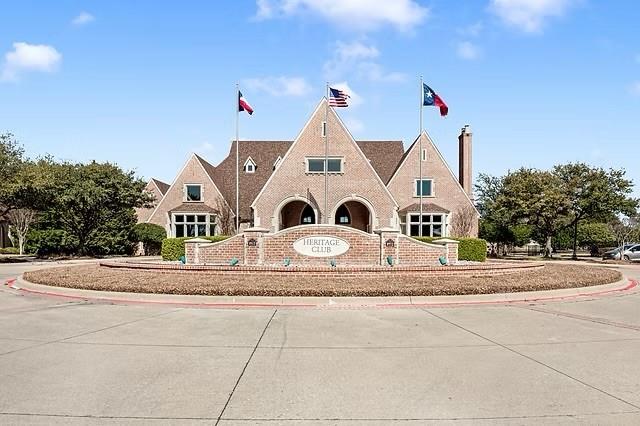 556 Avery Pointe Lavon, TX 75166 - Photo 30 of 32 a view of a house with a yard and garage