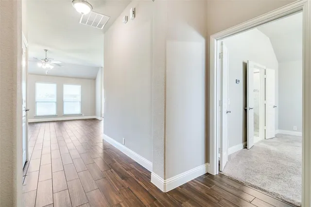 a view of livingroom with hardwood floor and hallway