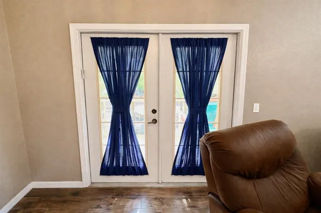 a view of a chairs and table in a balcony