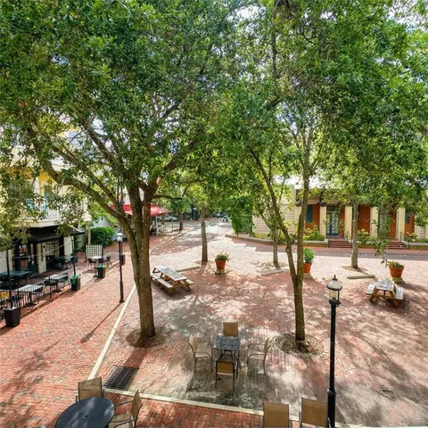 a view of a cafe with sitting area