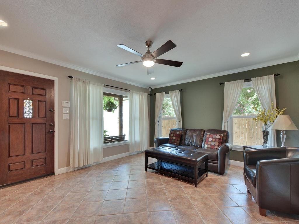 610 West N Loop Boulevard Austin, TX 78751 - Photo 8 of 29 Living room featuring tiled flooring, a ceiling fan, and recessed lighting