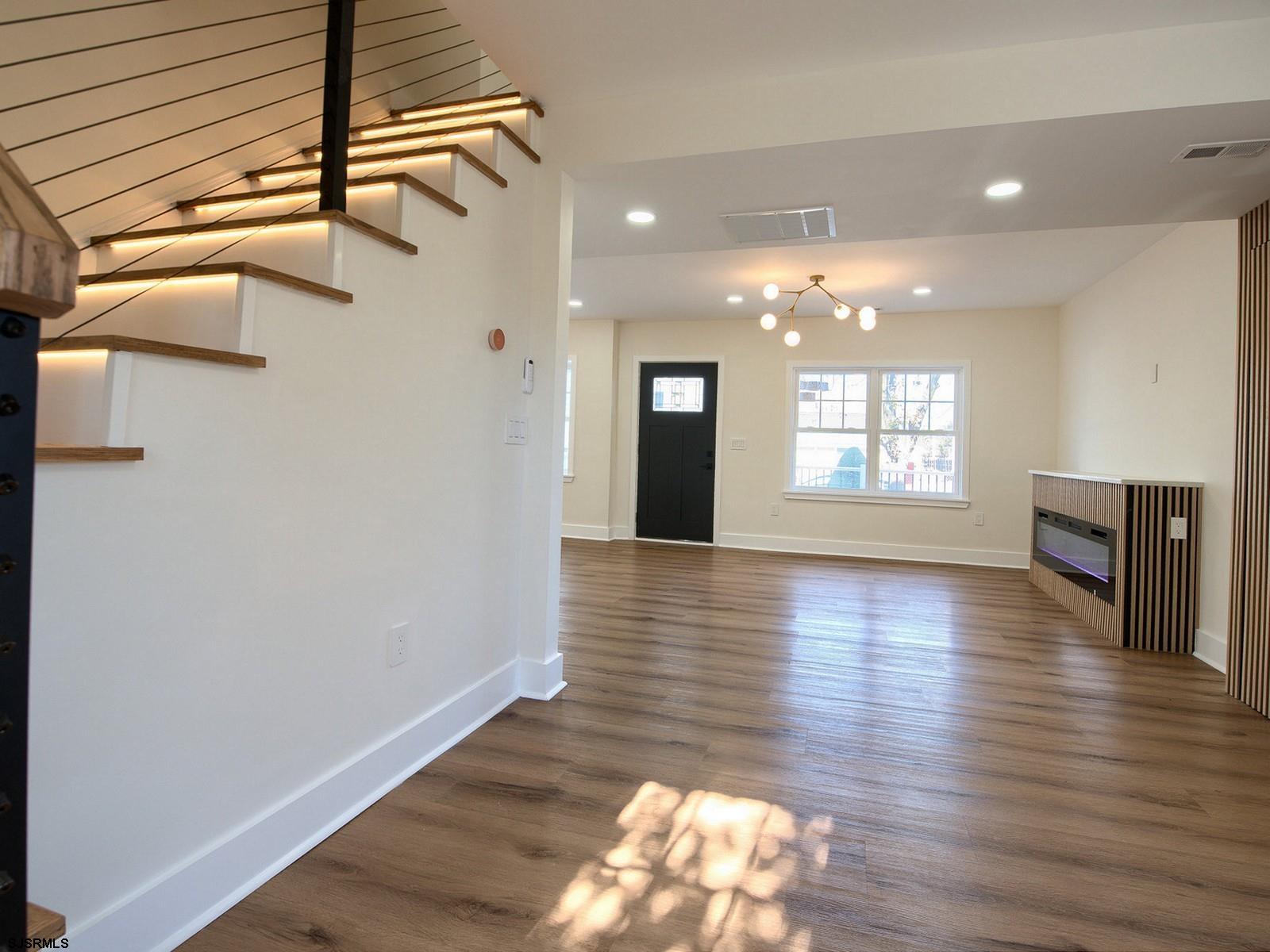 706 Augustine Road Atlantic City, NJ 08401 - Photo 23 of 56 a view of an empty room with wooden floor and a window