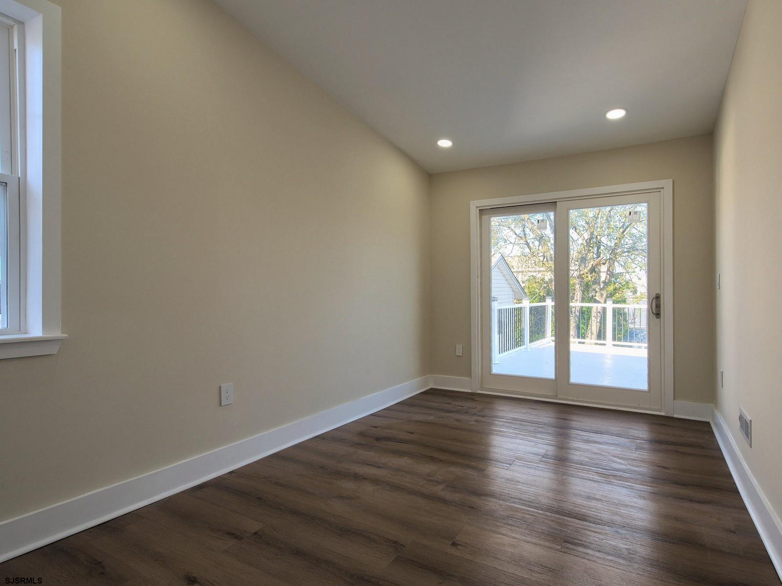 706 Augustine Road Atlantic City, NJ 08401 - Photo 33 of 56 a view of empty room with wooden floor and fan