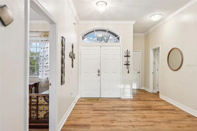 a view of a entryway door with wooden floor