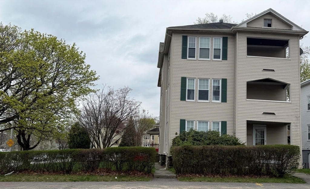 352 Chandler Street, Unit 1 Worcester, MA 01602 - Photo 1 of 23 a front view of a house with a yard