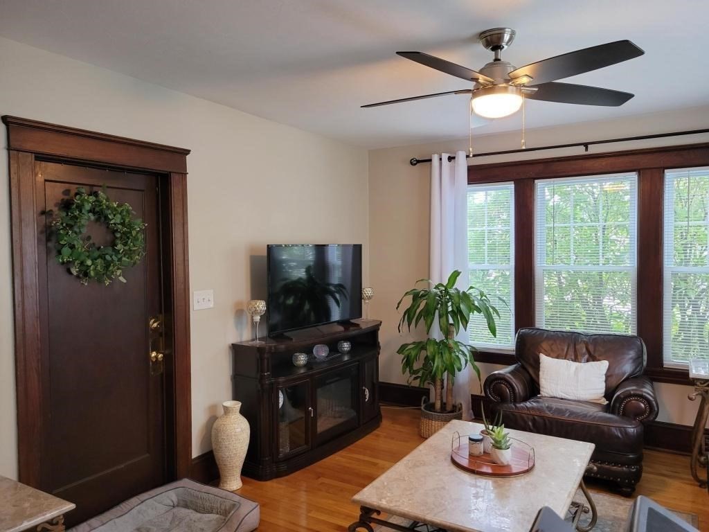 352 Chandler Street, Unit 1 Worcester, MA 01602 - Photo 18 of 23 a living room with furniture and a flat screen tv