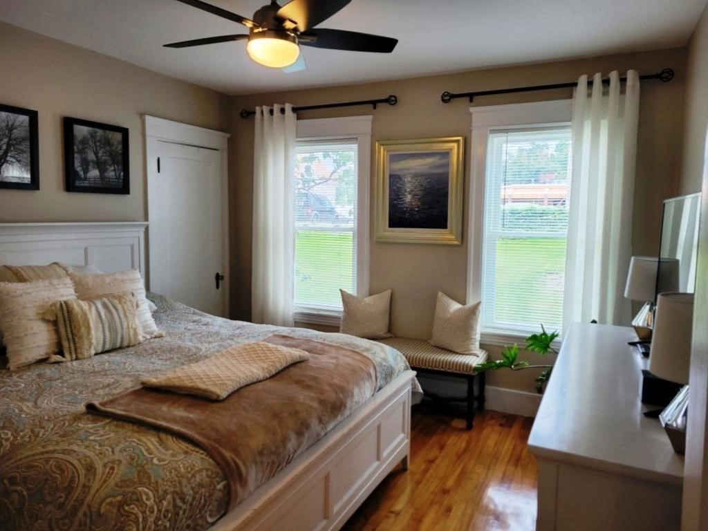352 Chandler Street, Unit 1 Worcester, MA 01602 - Photo 7 of 23 a bedroom with a bed and a chandelier