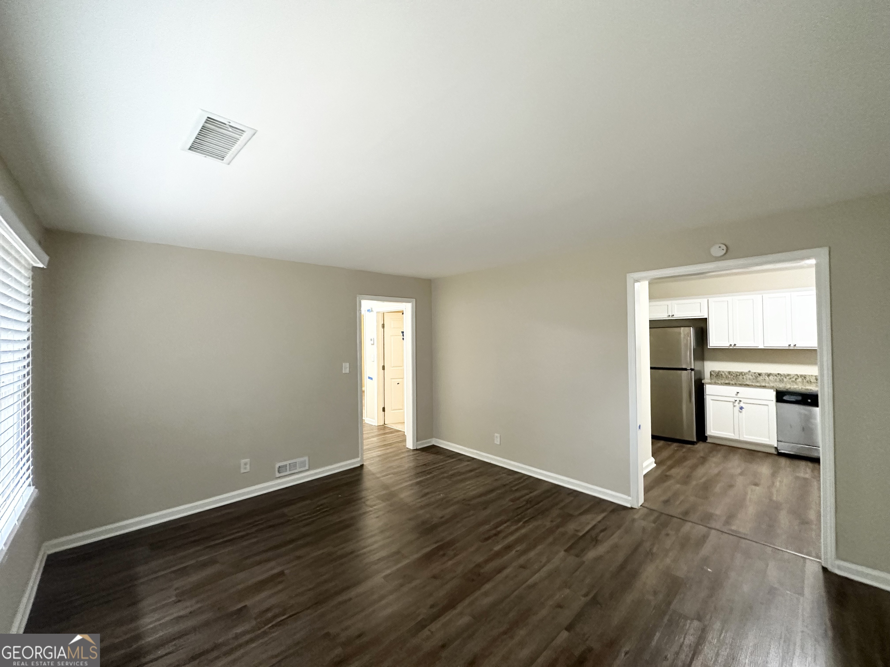 2310 Ousley Court Decatur, GA 30032 - Photo 3 of 11 a view of empty room with wooden floor
