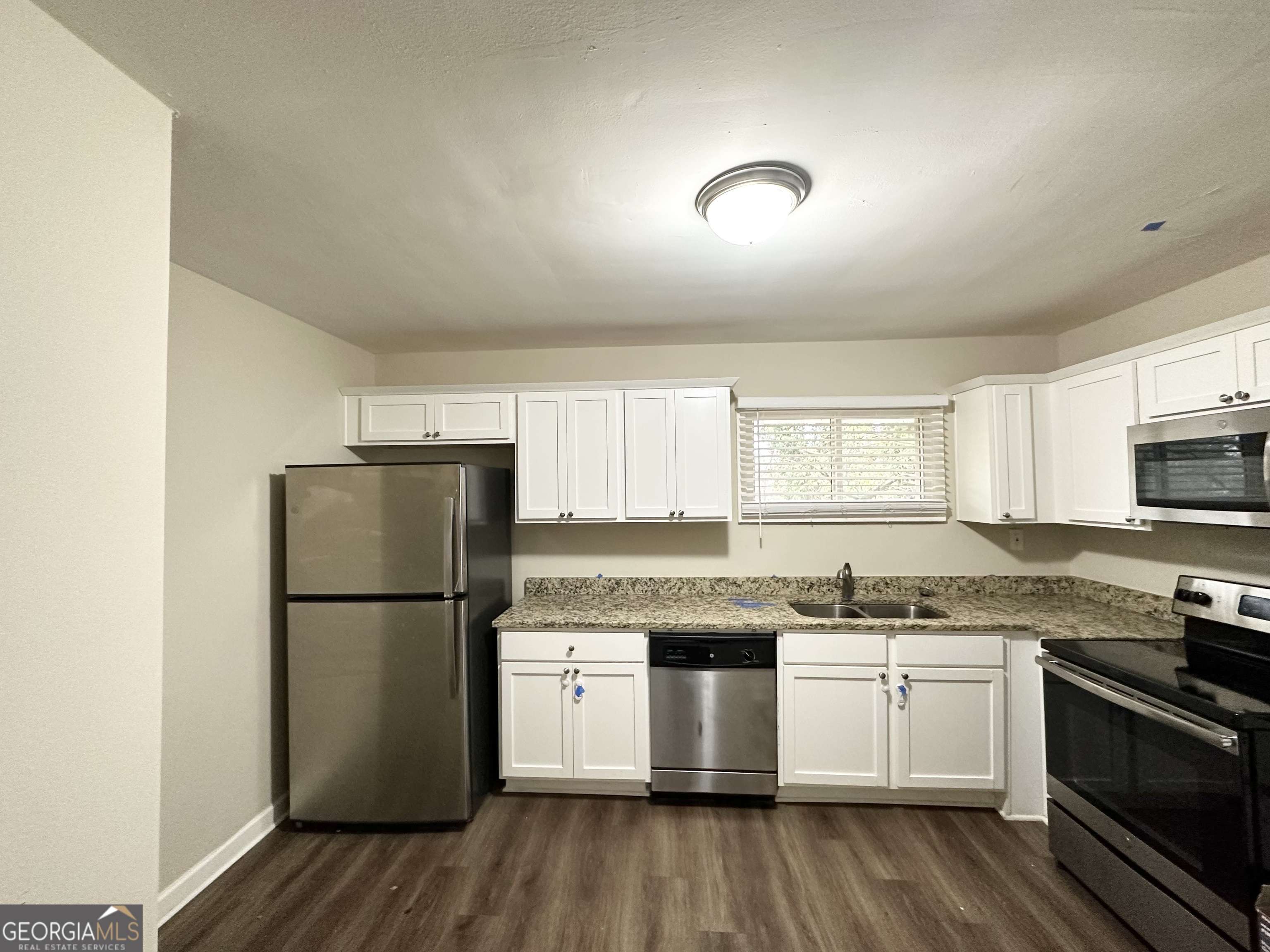 2310 Ousley Court Decatur, GA 30032 - Photo 5 of 11 a kitchen with a refrigerator stove and microwave