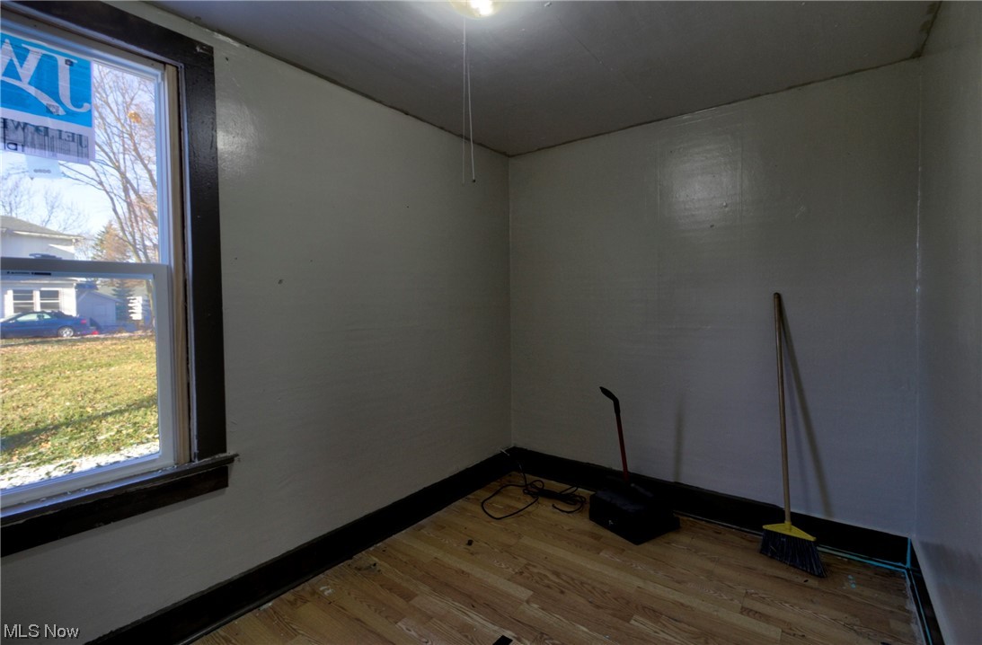 1312 Milan Road Sandusky, OH 44870 - Photo 10 of 14 Unfurnished room with light hardwood / wood-style flooring