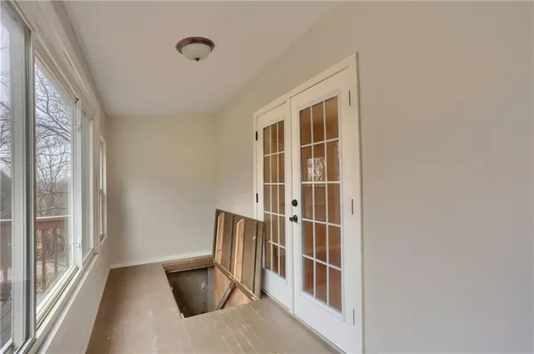 a view of an empty room and shelves