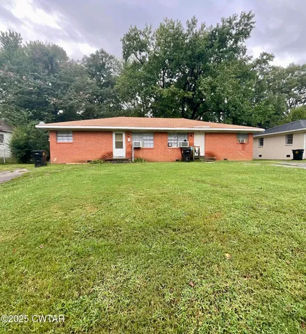 a house view with a garden space