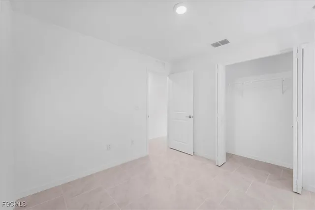 a view of a bathroom from a hallway