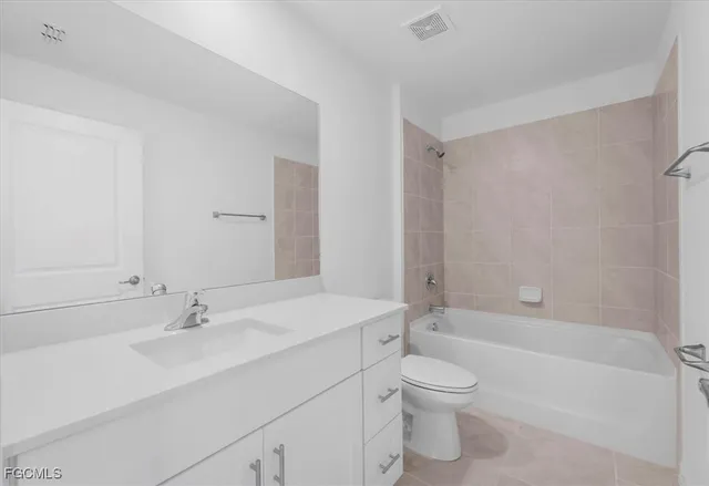 a view of an empty room and a window