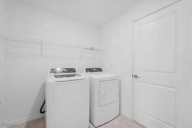a view of kitchen with stainless steel appliances kitchen island granite countertop a refrigerator and a stove top oven