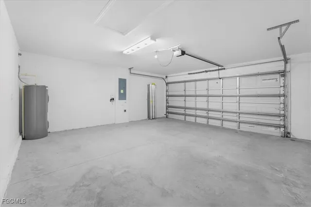 a view of a kitchen with a sink and a refrigerator