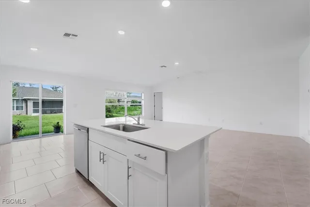 a view of kitchen with white cabinets
