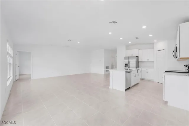 a bathroom with 2 sink and a mirror