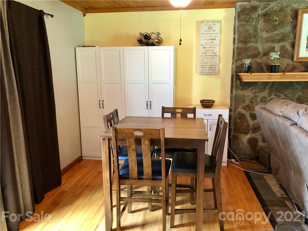 800 Pitts Road Catawba, SC 29704 - Photo 14 of 25 a view of a dining room with furniture and wooden floor