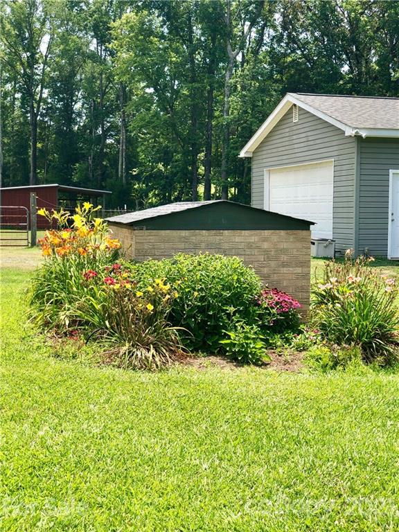 800 Pitts Road Catawba, SC 29704 - Photo 3 of 25 a front view of a house with a yard and potted plants