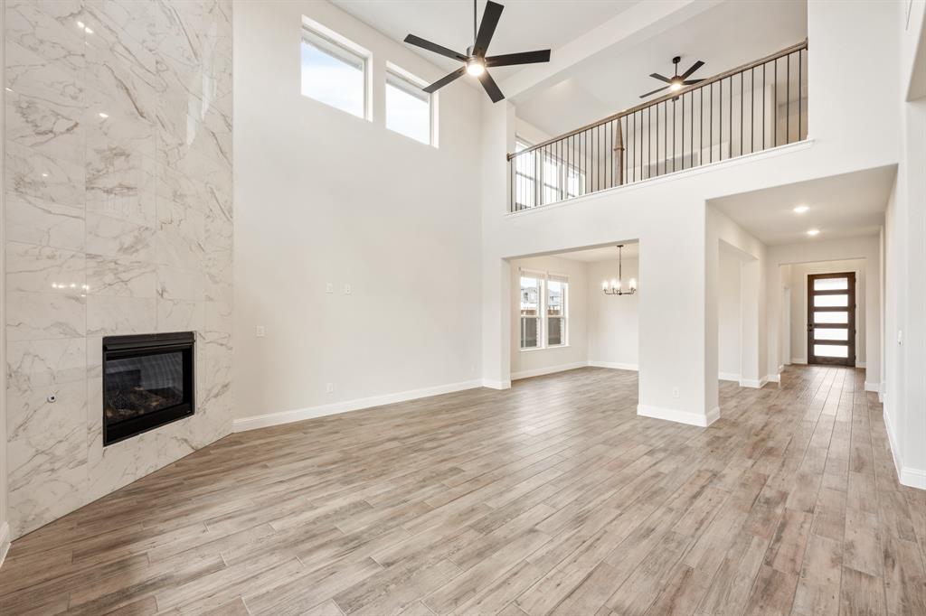 1630 Secco Way Rockwall, TX 75032 - Photo 12 of 40 a view of a livingroom with wooden floor