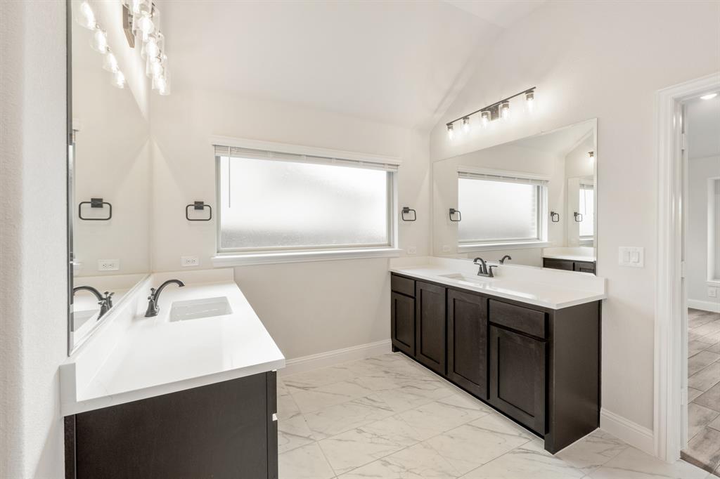 1630 Secco Way Rockwall, TX 75032 - Photo 24 of 40 a bathroom with a sink vanity and mirror